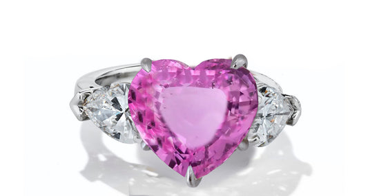 631 custom made unique heart pink sapphire center stone and heart diamond accent three stone engagement ring