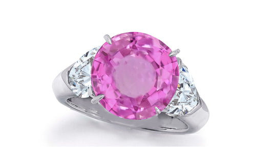 637 custom made unique round pink sapphire center stone and heart diamond accent three stone engagement ring
