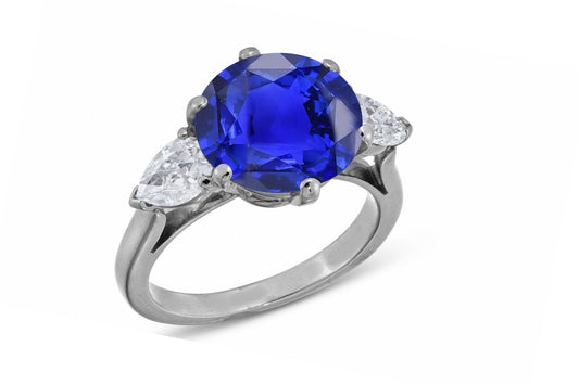 638 custom made unique round blue sapphire center stone and pears diamond accent three stone engagement ring