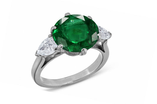 638 custom made unique round emerald center stone and pears diamond accent three stone engagement ring