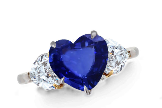 640 custom made unique heart blue sapphire center stone and heart diamond accent three stone engagement ring