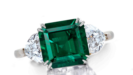 641 custom made unique asscher emerald center stone and heart diamond accent three stone engagement ring