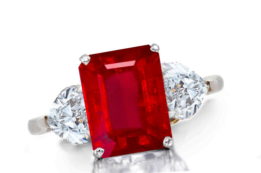 642 custom made unique emerald cut ruby center stone and heart diamond accent three stone engagement ring