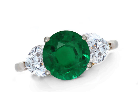 643 custom made unique round emerald center stone and heart diamond accent three stone engagement ring