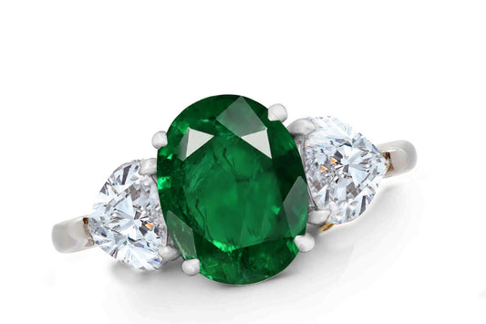 644 custom made unique oval emerald center stone and heart diamond accent three stone engagement ring
