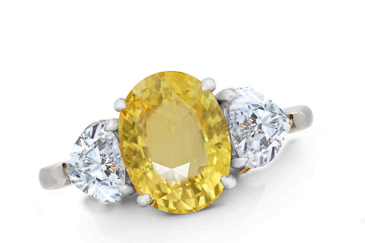 644 custom made unique oval yellow sapphire center stone and heart diamond accent three stone engagement ring