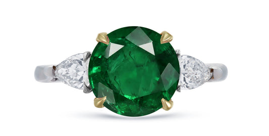 645 custom made unique round emerald center stone and pears diamond accent three stone engagement ring