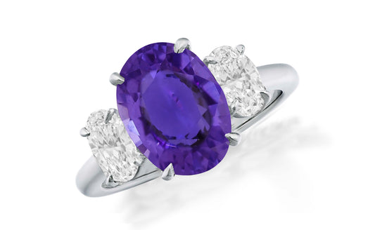 648 custom made unique oval purple sapphire center stone and oval diamond accent three stone engagement ring