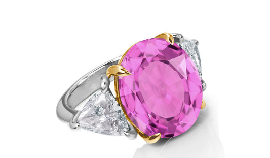 649 custom made unique oval pink sapphire center stone and trillion diamond accent three stone engagement ring