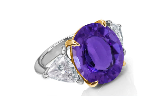 649 custom made unique oval purple sapphire center stone and trillion diamond accent three stone engagement ring