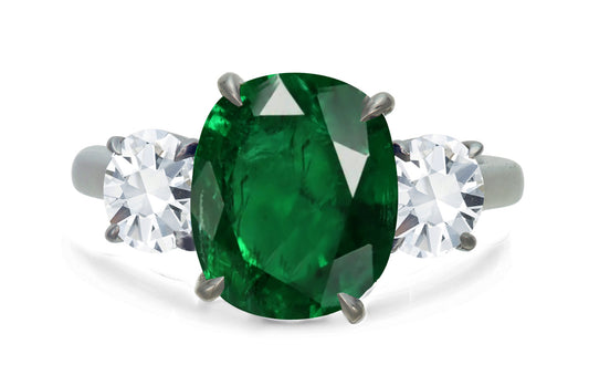 650 custom made unique oval emerald center stone and round diamond accent three stone engagement ring