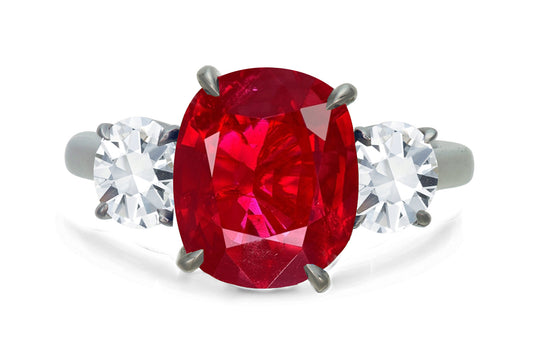 650 custom made unique oval ruby center stone and round diamond accent three stone engagement ring