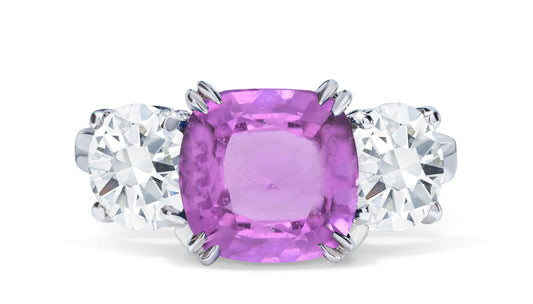 651 custom made unique cushion pink sapphire center stone and round diamond accent three stone engagement ring