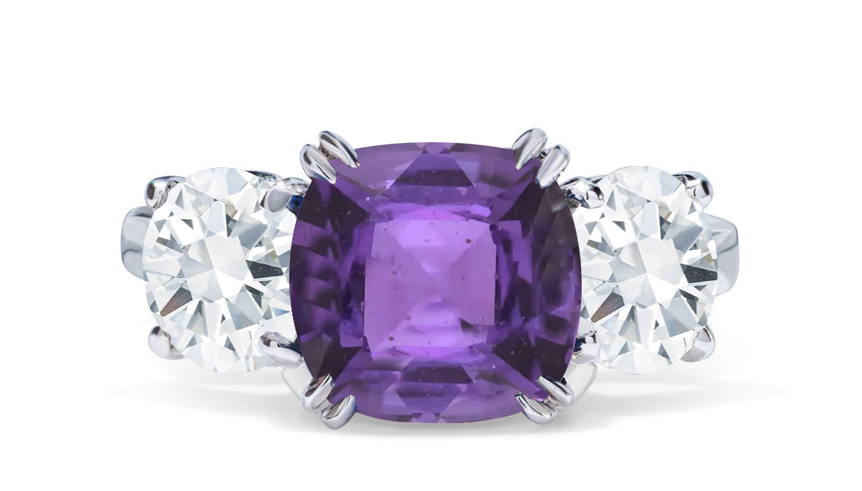 651 custom made unique cushion purple sapphire center stone and round diamond accent three stone engagement ring