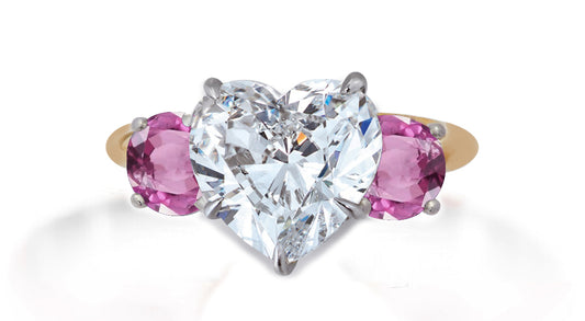 653 custom made unique heart diamond center stone and round pink sapphire accent three stone engagement ring