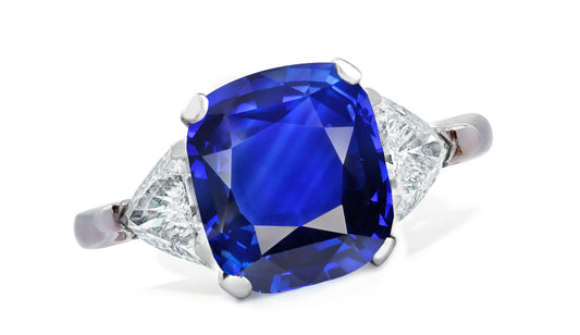 654 custom made unique cushion blue sapphire center stone and trillion diamond accent three stone engagement ring