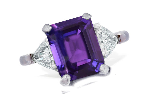655 custom made unique emerald cut purple sapphire center stone and trillion diamond accent three stone engagement ring