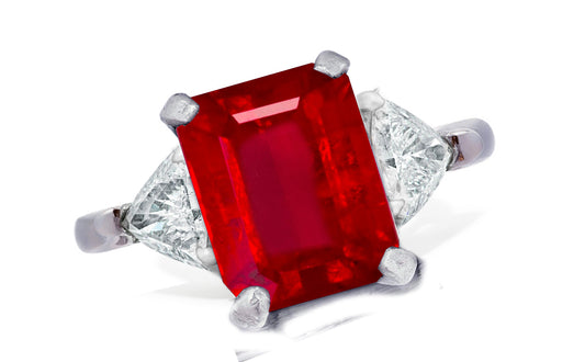 655 custom made unique emerald cut ruby center stone and trillion diamond accent three stone engagement ring
