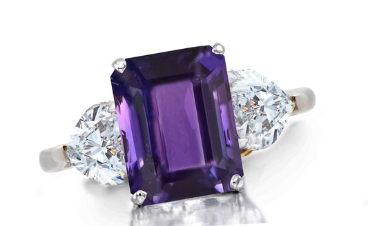657 custom made unique emerald cut purple sapphire center stone and heart diamond accent three stone engagement ring