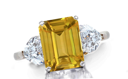 657 custom made unique emerald cut yellow sapphire center stone and heart diamond accent three stone engagement ring