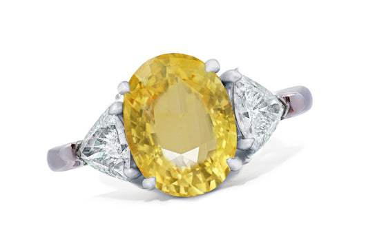 658 custom made unique oval yellow sapphire center stone and trillion diamond accent three stone engagement ring