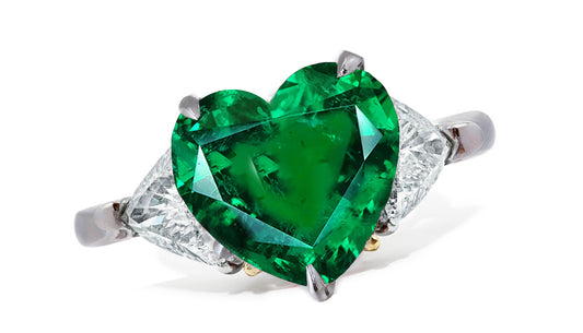 659 custom made unique heart emerald center stone and trillion diamond accent three stone engagement ring