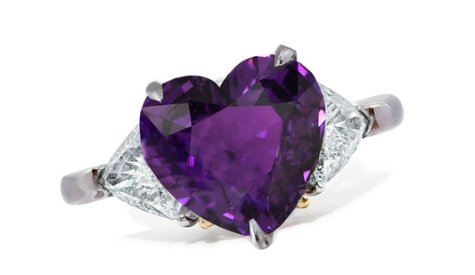 659 custom made unique heart purple sapphire center stone and trillion diamond accent three stone engagement ring