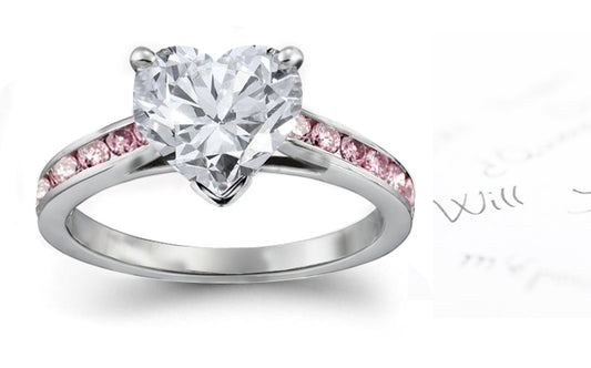 engagement ring with heart diamond center and band with channel set pink diamonds