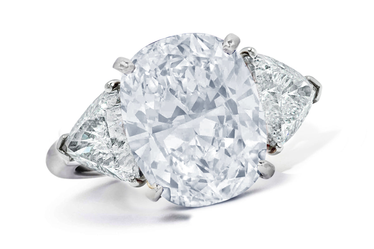 662 custom made unique oval diamond center stone and trillion diamond accent three stone engagement ring