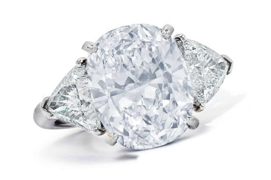 662 custom made unique oval diamond center stone and trillion diamond accent three stone engagement ring