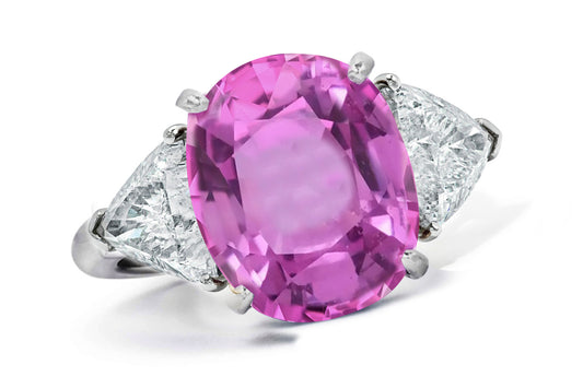 662 custom made unique oval pink sapphire center stone and trillion diamond accent three stone engagement ring
