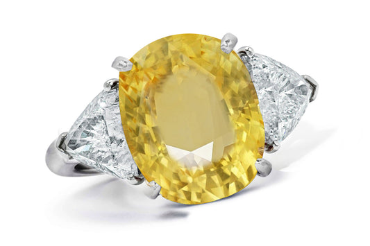 662 custom made unique oval yellow sapphire center stone and trillion diamond accent three stone engagement ring