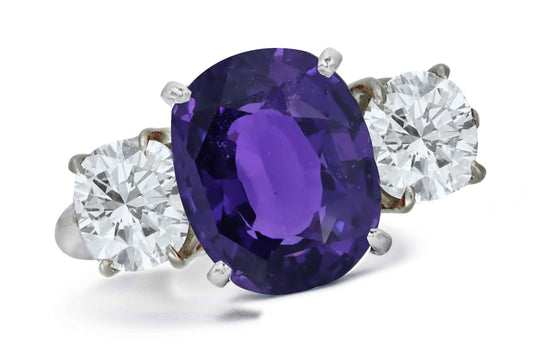 663 custom made unique oval purple sapphire center stone and round diamond accent three stone engagement ring