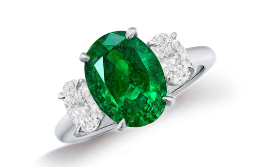 664 custom made unique oval emerald center stone and oval diamond accent three stone engagement ring