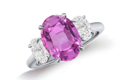 664 custom made unique oval pink sapphire center stone and oval diamond accent three stone engagement ring