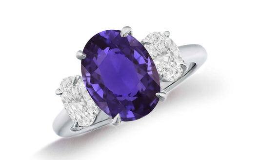 664 custom made unique oval purple sapphire center stone and oval diamond accent three stone engagement ring
