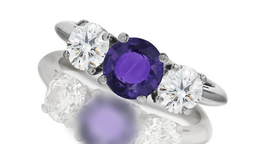 667 custom made unique round purple sapphire center stone and round diamond accent three stone engagement ring