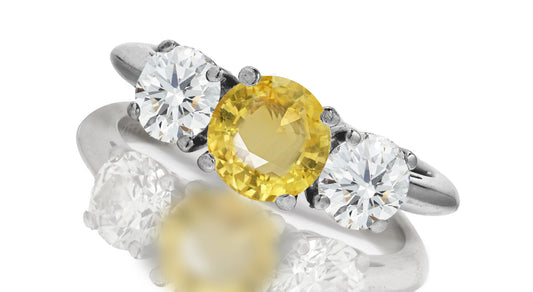 667 custom made unique round yellow sapphire center stone and round diamond accent three stone engagement ring