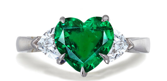 678 custom made unique heart emerald center stone and heart diamond accent three stone engagement ring
