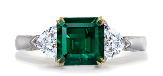 679 custom made unique asscher cut emerald center stone and heart diamond accent three stone engagement ring