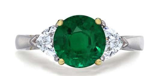 680 custom made unique round emerald center stone and heart diamond accent three stone engagement ring