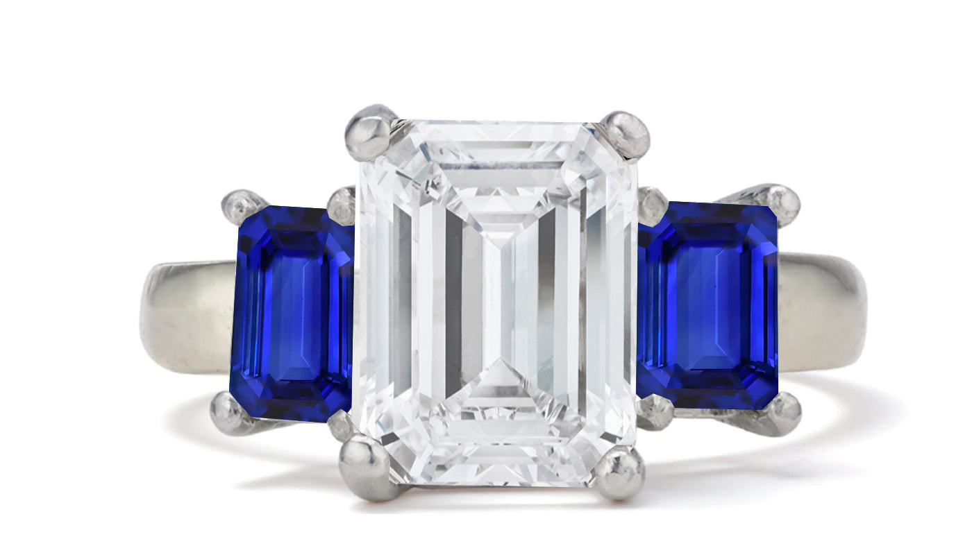 681 custom made unique emerald cut diamond center stone and emerald cut blue sapphire accent three stone engagement ring