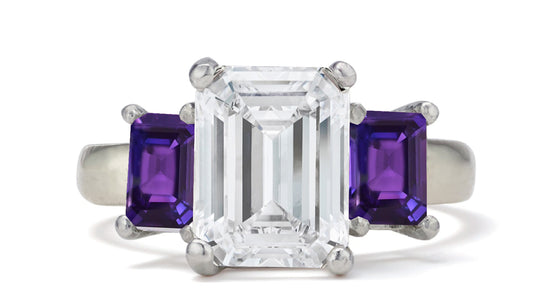 681 custom made unique emerald cut diamond center stone and emerald cut purple sapphire accent three stone engagement ring