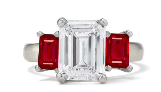 681 custom made unique emerald cut diamond center stone and emerald cut ruby accent three stone engagement ring