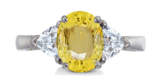 684 custom made unique oval yellow sapphire center stone and heart diamond accent three stone engagement ring