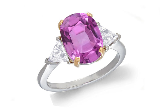 685 custom made unique oval pink sapphire center stone and trillion diamond accent three stone engagement ring