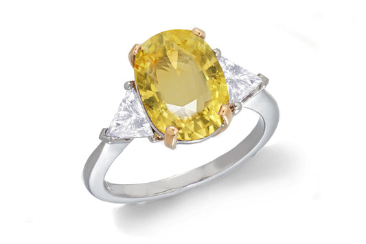 685 custom made unique oval yellow sapphire center stone and trillion diamond accent three stone engagement ring