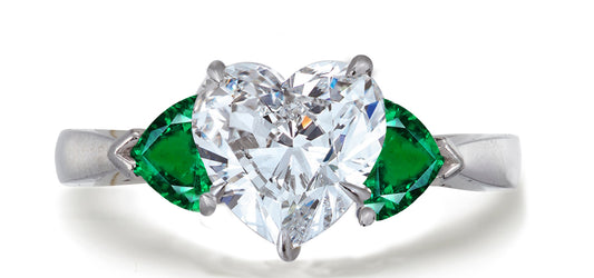 686 custom made unique heart diamond center stone and heart emerald accent three stone engagement ring