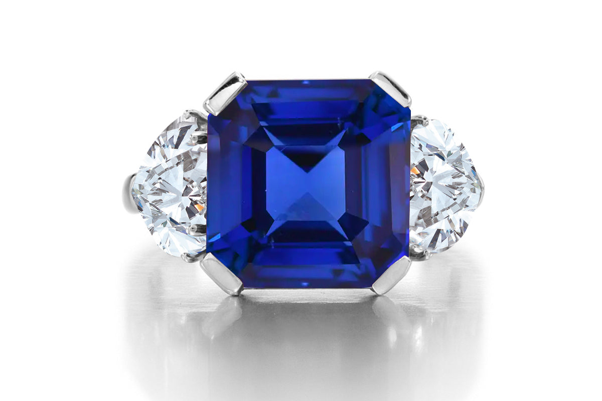 689 custom made unique asscher cut blue sapphire center stone and heart diamond accent three stone engagement ring