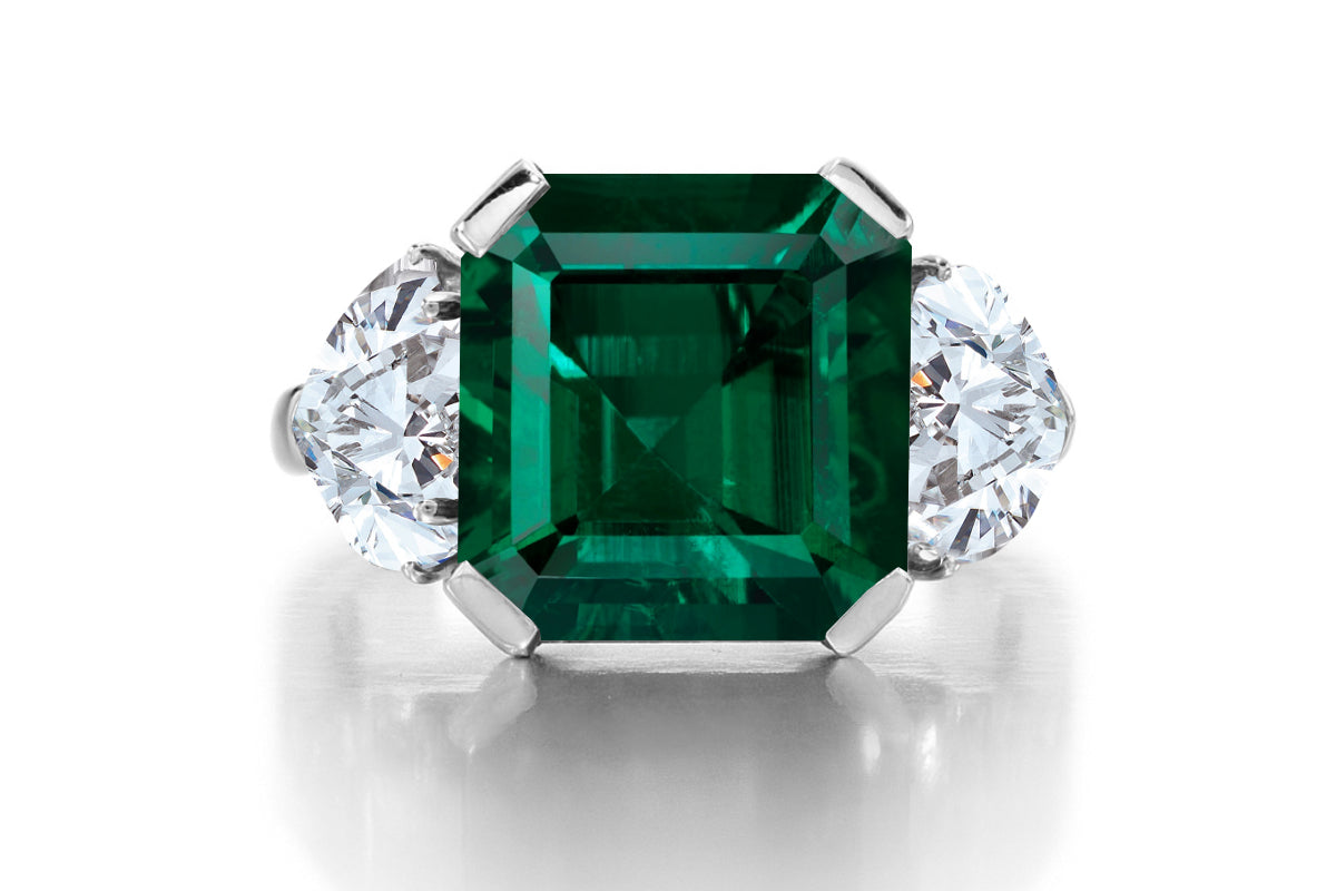 689 custom made unique asscher cut emerald center stone and heart diamond accent three stone engagement ring